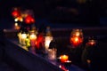 Flaming colored candle on the grave