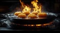 Flaming food, sizzling pan, kitchen, restaurant cooking Royalty Free Stock Photo