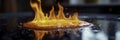 Flaming hot oil splatters on stovetop surface, stovetop, spill Royalty Free Stock Photo