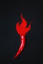 Flaming Pepper. Chili pepper turns into powder