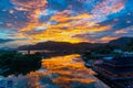 Amazing flaming red fire clouds over fishing port