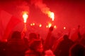 flaming red flare during a street protest in the city