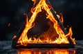A flaming triangle with intense fire and sparks creating a dramatic visual effect Royalty Free Stock Photo