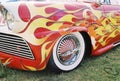 Flaming vintage car w/ naked lady rims Royalty Free Stock Photo