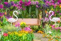 Flamingo Bird statue in flower garden.