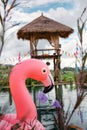 Flamingo Floating in Swimming Pool at Hotel Resort. Flamingo Float Rubber Water Toys Inflatable in The Swimming Pools. Summer Royalty Free Stock Photo