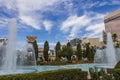 Caesars Palace Hotel, Casino and resort along the Las Vegas strip with tall lush green trees, water fountains, statues, blue sky Royalty Free Stock Photo