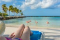 Flamingos beach in Aruba. Young woman resting Royalty Free Stock Photo