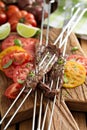 Flank steak on skewers with tomatoes Royalty Free Stock Photo