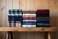 flannel fabric folded on a wooden shelf Royalty Free Stock Photo