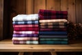 flannel fabric folded on a wooden shelf Royalty Free Stock Photo