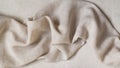 Flap of fine linen or hamp fabric on a gray background Royalty Free Stock Photo