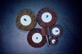 Flap Wheel. A pile of color abrasive Flap Wheel industrial on wood background texture. sandpaper wheel tool - professional equipme Royalty Free Stock Photo