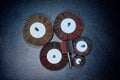 Flap Wheel. A pile of color abrasive Flap Wheel industrial on wood background texture. sandpaper wheel tool - professional equipme Royalty Free Stock Photo