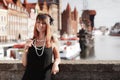 Flapper girl woman in1920s style standing on the street Royalty Free Stock Photo