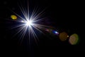 Flare effect. Sunlight ray flash on black background. Star spot or sun shine glow light on lens. Easy to add as overlay Royalty Free Stock Photo