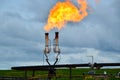 A flare stack burning off natural gas in North Dakota. Royalty Free Stock Photo