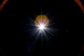 Flare wallpaper. Star spot or sun shine glow light on lens. Sunlight ray flash effect on black background. Optical Royalty Free Stock Photo