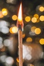 Flaring feelings symbol.flash of feelings. Burning matches pair on yellow bokeh blurred background.Transience of time
