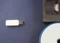Flash drive on a blue background discs and video cassette usb Royalty Free Stock Photo