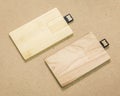 Flash drive card on brown cardboard texture background.  USB stick made from wood material concept Royalty Free Stock Photo