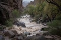 flash flood rushes through deep and winding canyon, with trees and rocks washed downstream Royalty Free Stock Photo