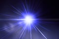 Flash light, lens flares, sun beams effect over dark blue background. Royalty Free Stock Photo