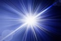 Flash light, lens flares, sun beams effect over dark blue background. Royalty Free Stock Photo