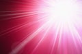 Flash light, lens flares, sun beams effect over pink background.