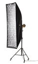 Flash light with strip softbox and grid stand with wheels. Studio lighting equipment isolated on white background