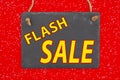 Flash Sale type message in a hanging blank chalkboard sign