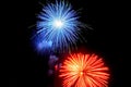 Flashes of blue red green fireworks against the black sky Royalty Free Stock Photo