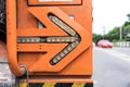 Flashing arrow on the back of old electrical service truck against blurred background Royalty Free Stock Photo