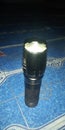 Flashlight bright light dissipate darkness Royalty Free Stock Photo