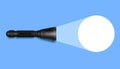 Flashlight with light on blue surface. Realistic black pocket device illuminates