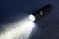 Flashlight on wet surface Royalty Free Stock Photo