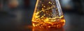 Flask with glowing liquid: chemical reaction, magic potion, or science experiment Royalty Free Stock Photo
