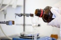 Flasks with liquids in a lab, pharmaceutical industry factory and production laboratory, chemistry concept Royalty Free Stock Photo