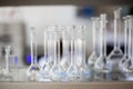 Flasks with liquids in a lab, pharmaceutical industry factory and production laboratory, chemistry concept Royalty Free Stock Photo