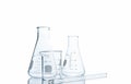 Flasks and measuring beaker for science experiment Royalty Free Stock Photo