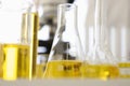 Flasks and test tubes contain yellow liquid Royalty Free Stock Photo