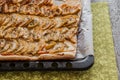 Flat apple pie on a baking sheet Royalty Free Stock Photo