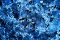 Flat background of ice layers on black. Beautiful background in blue shades with elements of air bubbles Royalty Free Stock Photo