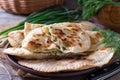 Flat bread with herbs, kutaby, traditional Azerbaijani dish on a plate