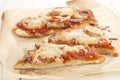 Flat bread pizza with tomato and salami
