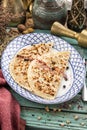 Flat bread qutab on blue wooden table traditional Azerbaijani cuisine