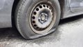 flat car tire close up, punctured wheel Royalty Free Stock Photo