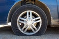 Flat Car Tire on Gravel Road Royalty Free Stock Photo