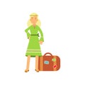 Flat cartoon blonde woman hippie character standing near retro suitcase. Happy flower child female in green dress.