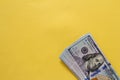 Flat closeup of dollars on yellow background. Investment profit income. Success concept. Finance investment concept. Dollar sign.